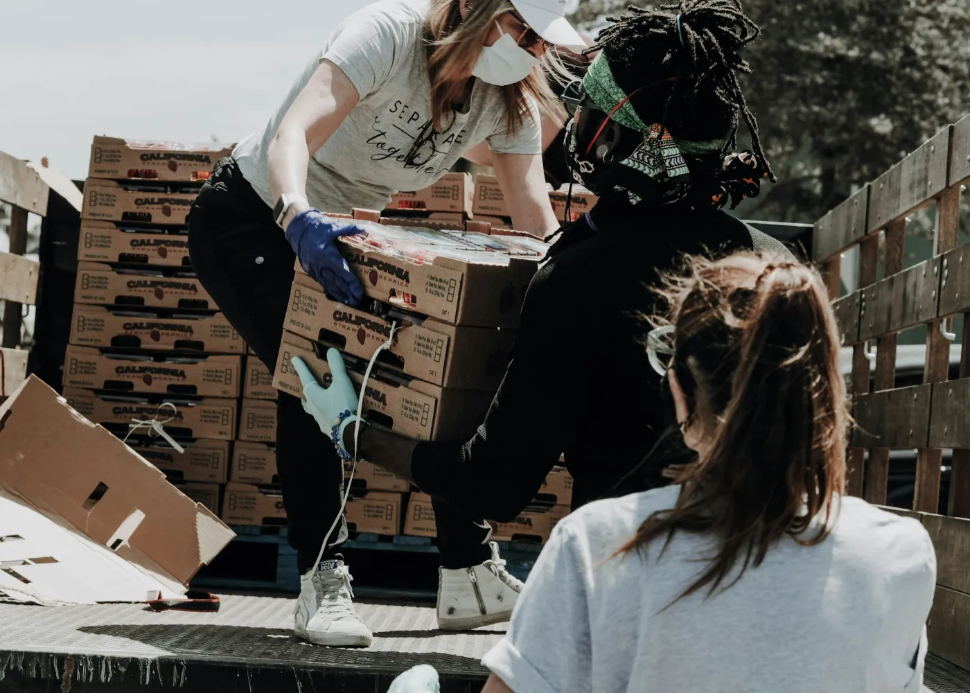 Volunteers unloading boxes