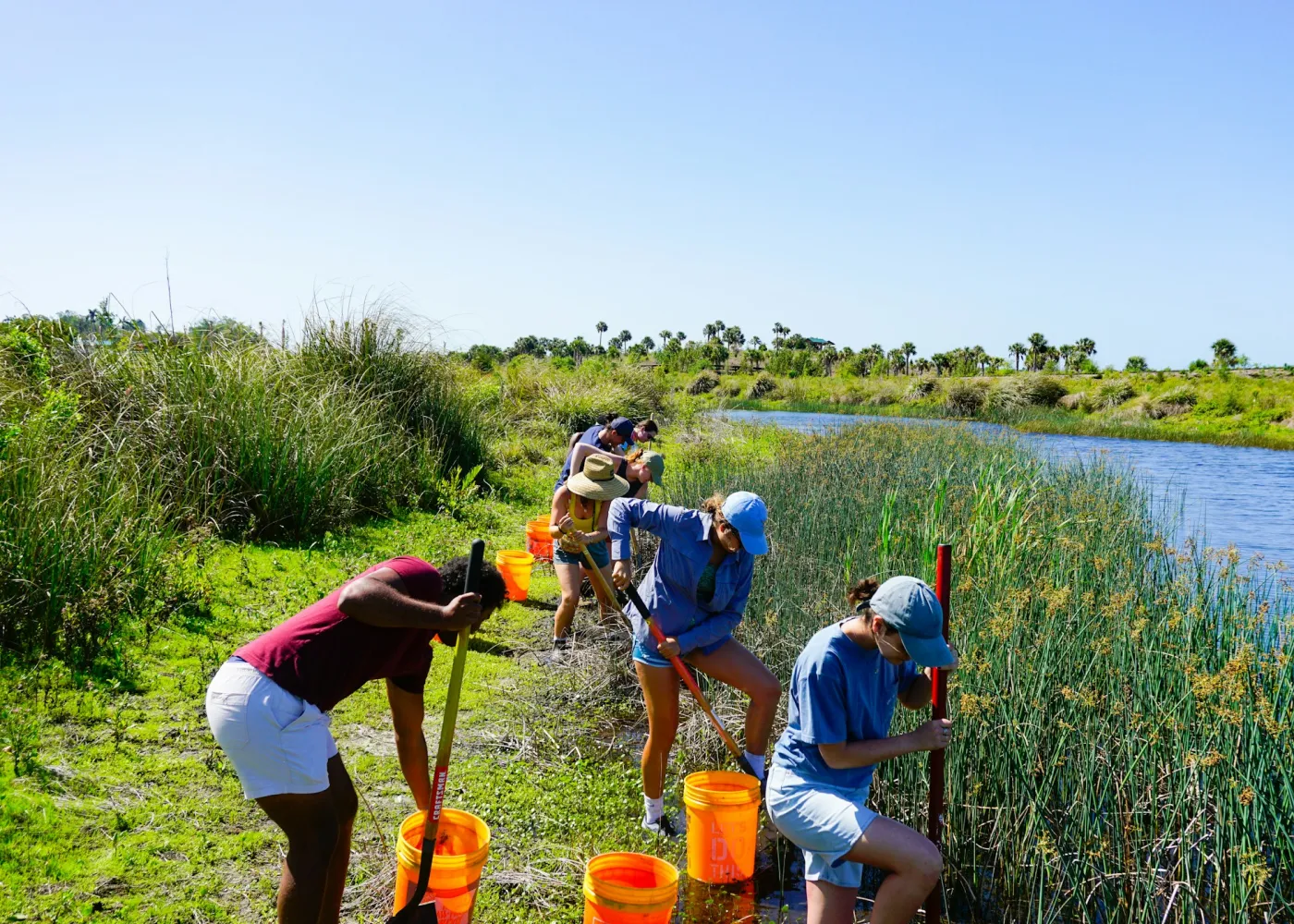 Volunteers working by a river